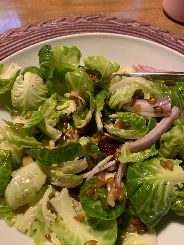 Brussels sprouts, shallots, rye berries and walnuts in a salad
