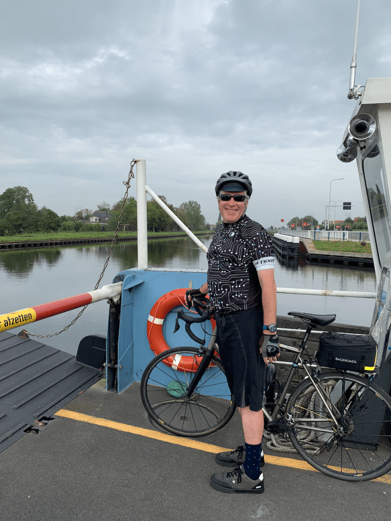 Cyclist on a paused river ferry